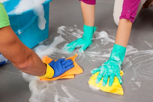 Professional cleaners working in a Chelsea area home for a deep clean