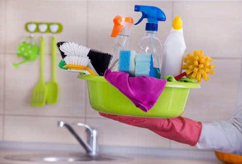 Cleaning professional maintaining an office workspace in SW3