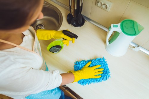 Cleaner preparing to treat office carpets in a Chelsea-style commercial property
